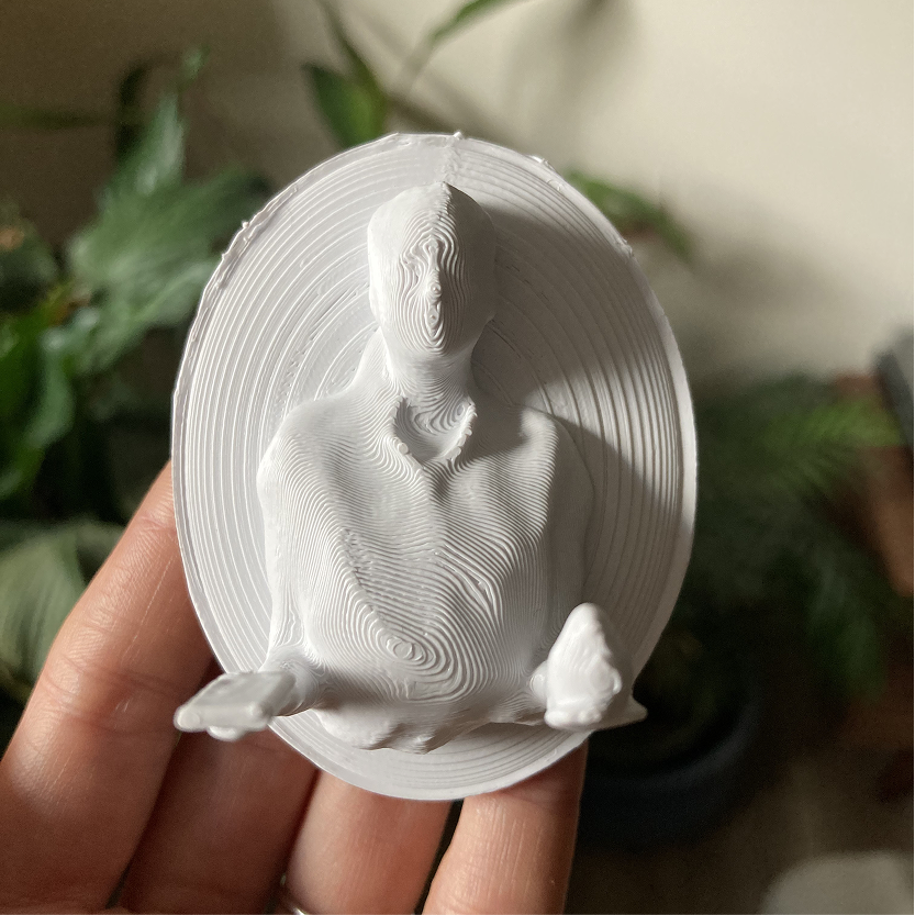 For this project, I wanted to create a 3D printed selfie as a way of capturing time. I scanned myself using photogrammetry - my arms are outstretched, palms facing up displaying two objects, a journal and a bird. The journal was bought by my spouse, a current relationship, and I as a way of recording future events to remember them. The bird is from my spouse’s grandma who is now deceased. These objects are symbolic of relationships past, present, and future. These relationships have shaped and influenced me in ways seen and unseen. As this concept combines old and new, I wanted to embed this idea into my final design and decided to make it in the style of a Cameo Brooch - an object that is used in the present but calls back to an older time.
